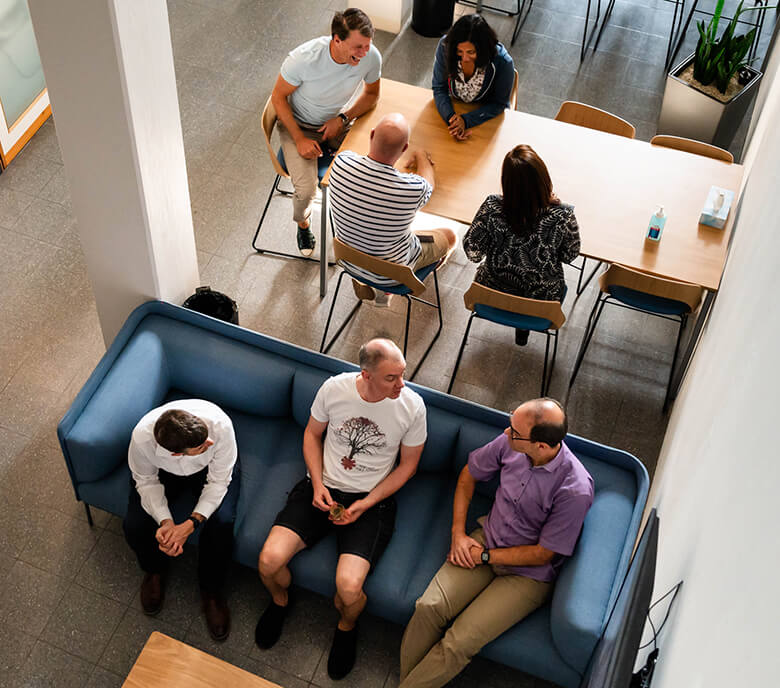 Two groups of Monte Rosa staff meet in the common space in the Basel location.